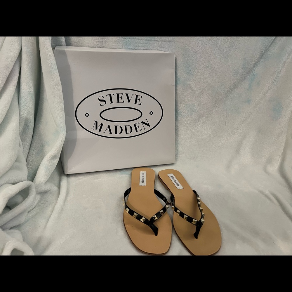 Steve madden black and gold flip flops/sandals.